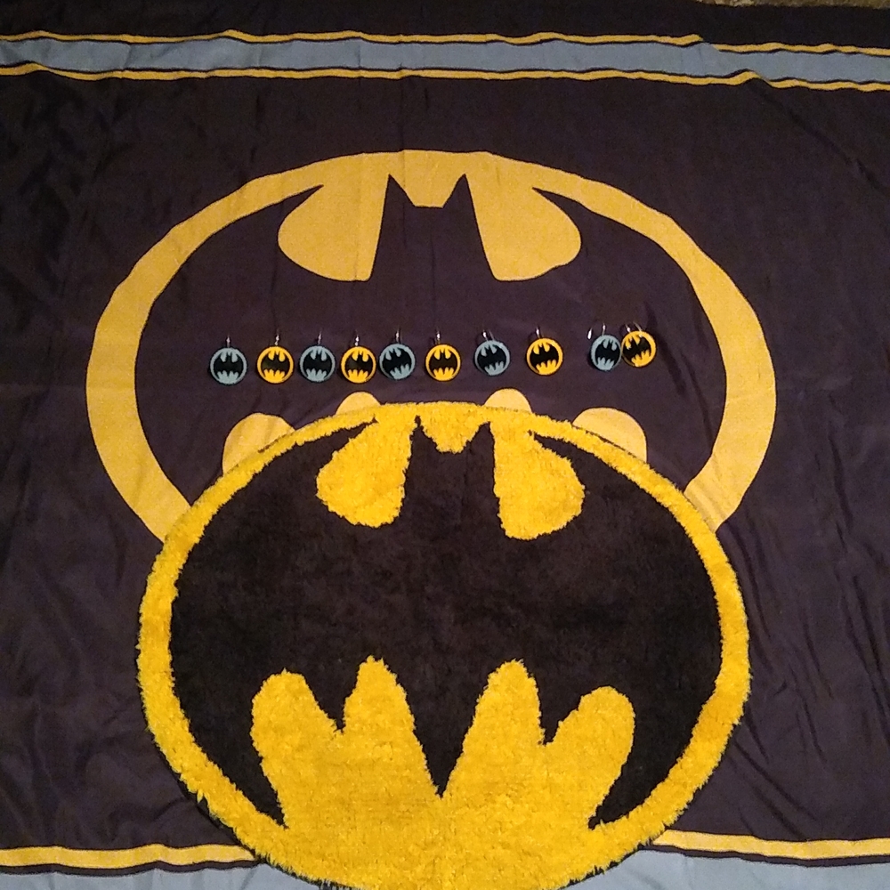 Batman bathroom: shower hooks, shower curtain, and a Batman rug